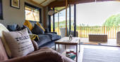 Living room area inside the safari lodge at at Bird Holme Glamping in Nottinghamshire