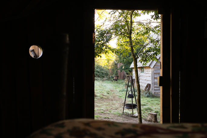 Looking out from the bed inside Pixie Yurt at Mill Valley in Cornwall
