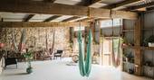 The communal area and the fabric swings at Southcombe Piggery, Dartmoor, Devon
