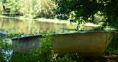 Little boat on the side of the lake at GoGreen holidays, Saint Priest Les Fougeres, Dordogne, France